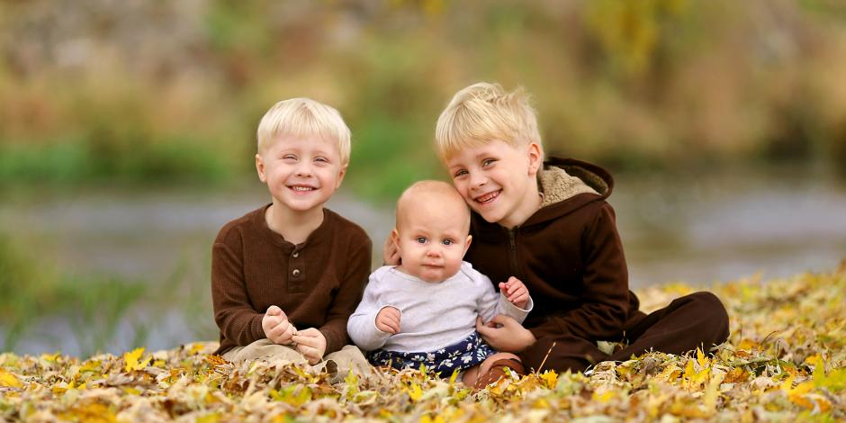 kids playing in leaves fall New England